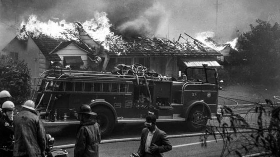 Firefighters are not able to save a home on Roscomare Road in 1961. (Credit: Los Angeles Times)