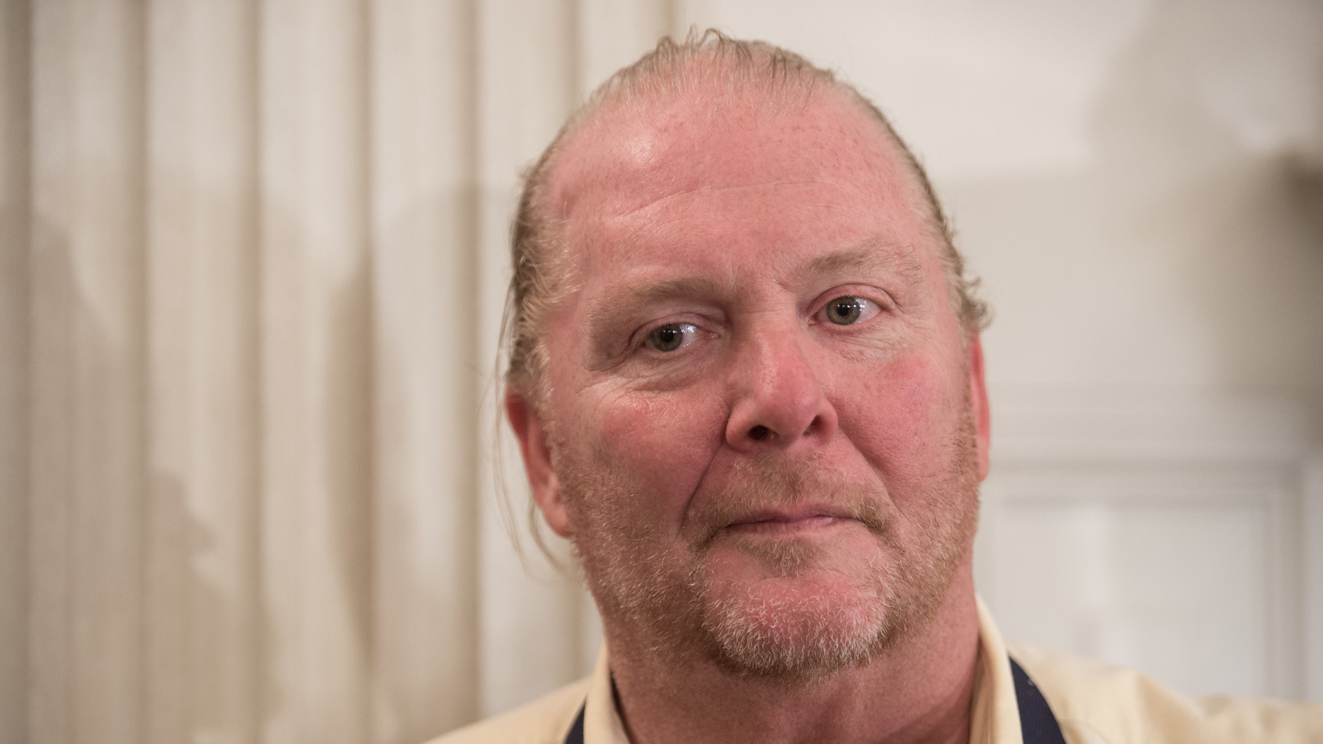 Chef Mario Batali looks on at the White House in Washington, DC, on Oct. 17, 2016, during a preview of the state dinner to be held the following day for Italian Prime Minister Matteo Renzi and his wife Agnese Landini. (Credit: Nicholas Kamm/AFP/Getty Images)