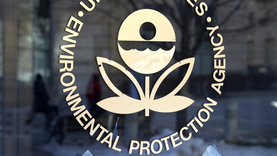 The U.S. Environmental Protection Agency's logo is displayed on a door at its headquarters on March 16, 2017, in Washington, D.C. (Credit: Justin Sullivan/Getty Images)