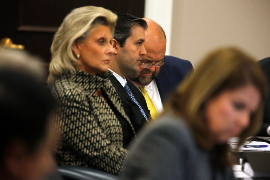 Defense attorney Miller Shealy, right, and assistant Cheryl Savage sit with former North Charleston police officer Michael Slager, center, after a note was sent by the jury as they continue to deliberate at the Charleston County court in Charleston, S.C., Dec. 5, 2016. (Credit: Grace Beahm - Pool/Getty Images)