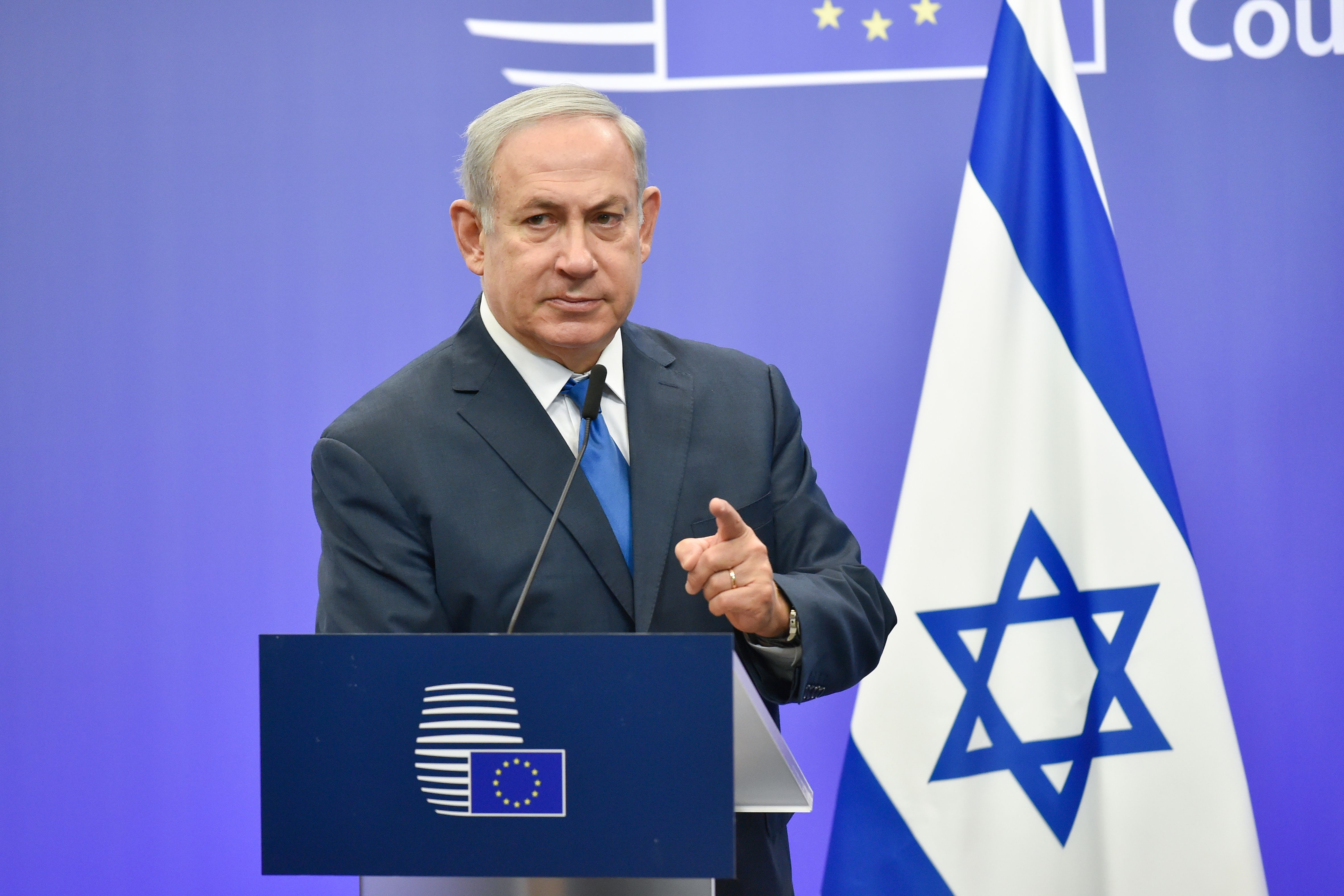 Israel's Prime Minister Benjamin Netanyahu gestures as he speaks during a joint press conference with the EU foreign policy chief, at the European Council in Brussels on December 11, 2017. (Credit: JOHN THYS/AFP/Getty Images)