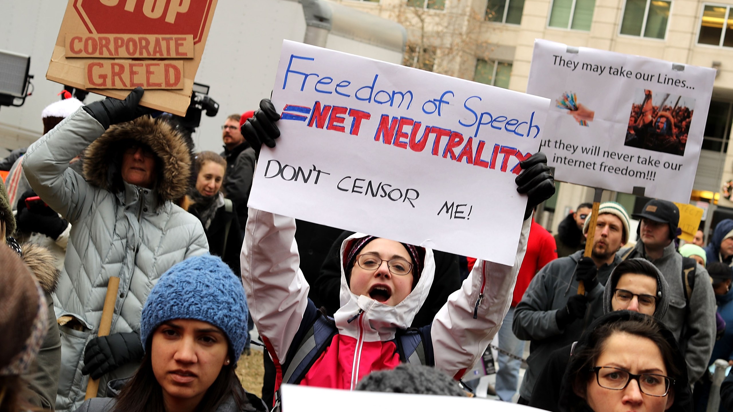 Demonstrators rally outside the Federal Communication Commission building to protest against the end of net neutrality rules on December 14, 2017 in Washington, DC. (Credit: Chip Somodevilla/Getty Images)