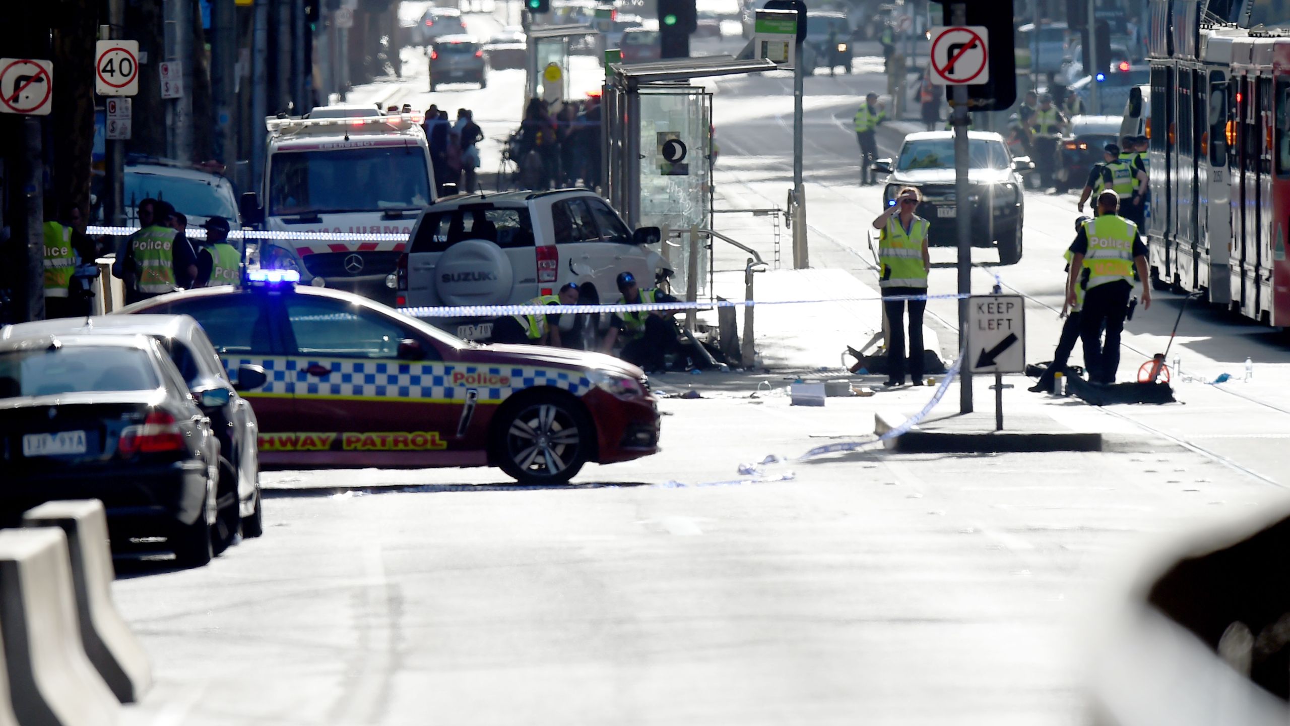 Police and emergency personnel work at the scene of where a car ran over pedestrians in Flinders Street in Melbourne on Dec. 21, 2017. (Credit: Mal Fairclough/AFP/Getty Images)