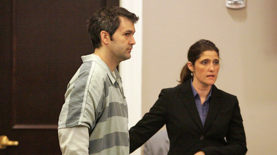 Michael Slager stands as defense attorney Cameron Blazer guides him toward the podium to speak in circuit court for the first time at the Charleston County Court House September 11, 2015 in Charleston, South Carolina. (Credit: Leroy Burnell - Pool/Getty Images)