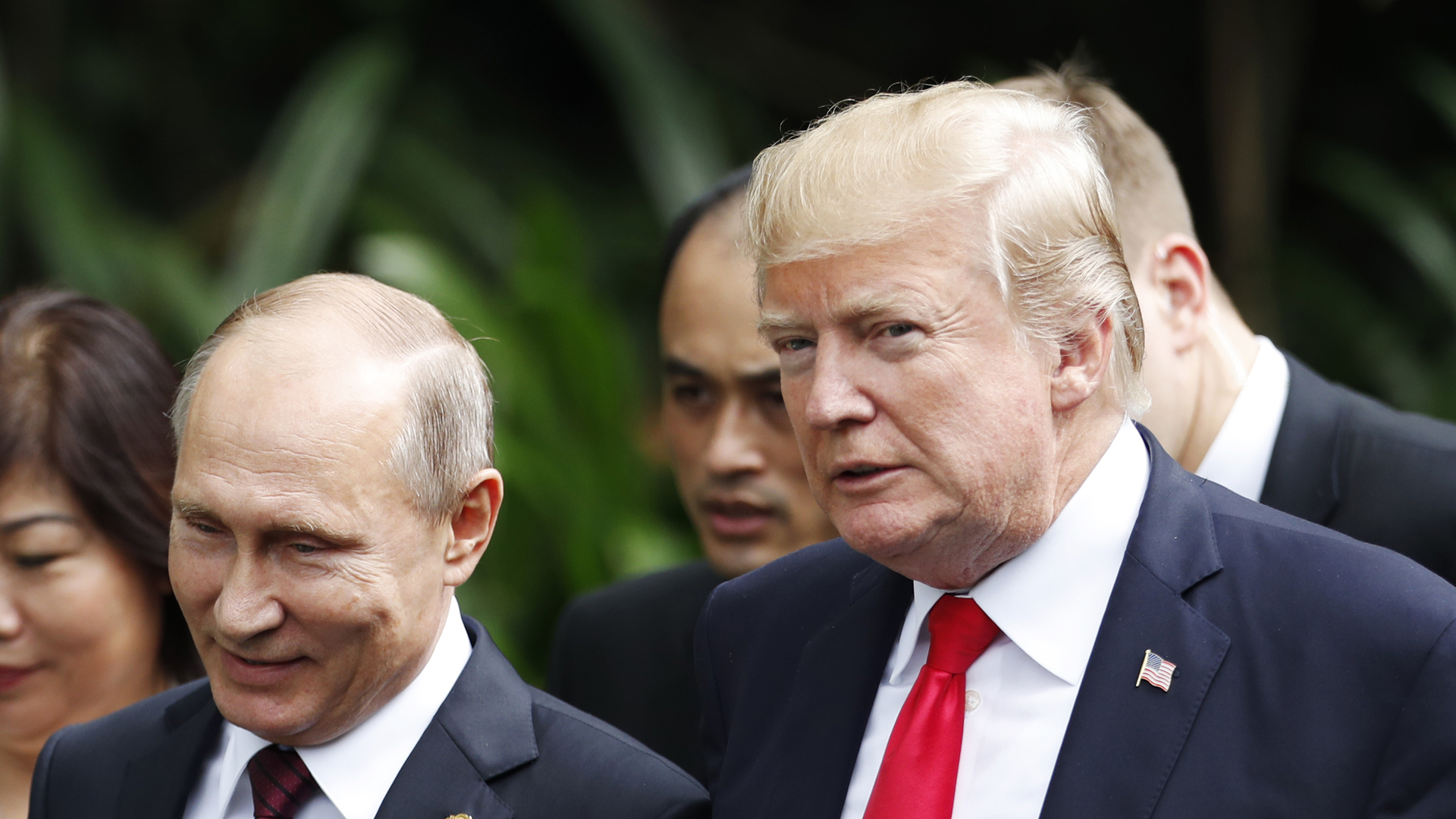 U.S. President Donald Trump and Russia's President Vladimir Putin walk together to take part in the "family photo" during the Asia-Pacific Economic Cooperation leaders' summit in the central Vietnamese city of Danang on Nov. 11, 2017. (Credit: Jorge Silva/AFP/Getty Images)