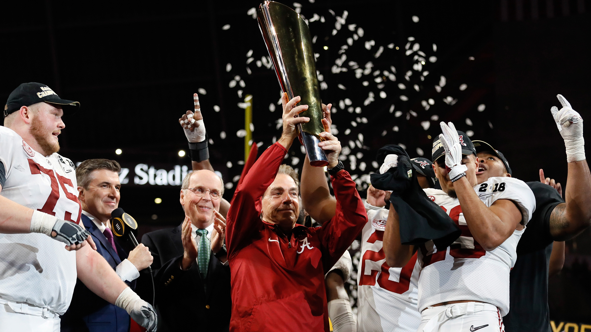 Head coach Nick Saban of the Alabama Crimson Tide holds the trophy while celebrating with his team after defeating the Georgia Bulldogs in overtime to win the CFP National Championship presented by AT&T at Mercedes-Benz Stadium on January 8, 2018 in Atlanta, Georgia. (Credit: Jamie Squire/Getty Images)