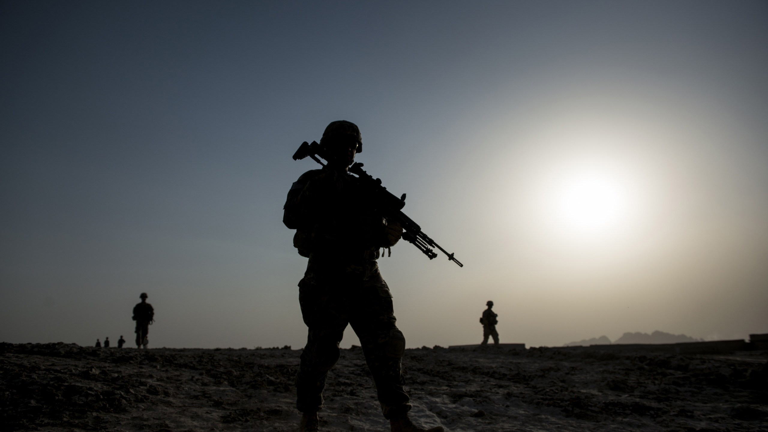 U.S. soldiers patrol near Kandahar Airfield on June 3, 2014. (Credit: BRENDAN SMIALOWSKI/AFP/Getty Images)