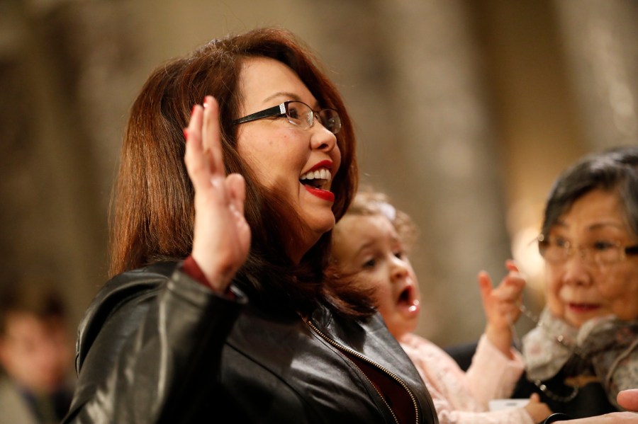 Sen. Tammy Duckworth participates in a reenacted swearing-in with U.S. Vice President Joe Biden in the Old Senate Chamber at the U.S. Capitol Jan. 3, 2017. (Credit: Aaron P. Bernstein/Getty Images)