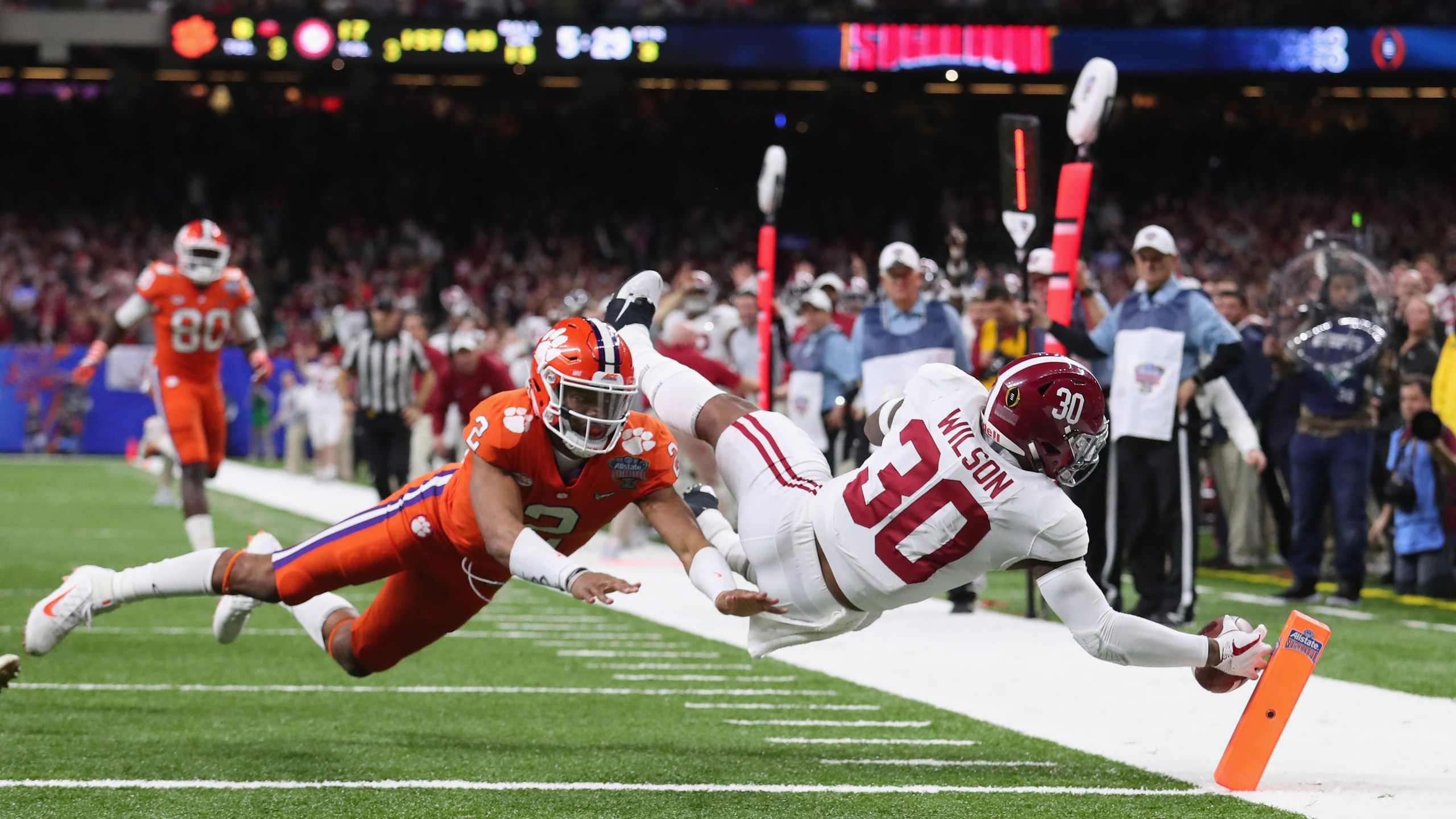 Mack Wilson #30 of the Alabama Crimson Tide scores a touchdown on an interception as Kelly Bryant #2 of the Clemson Tigers defends in the second half of the AllState Sugar Bowl at the Mercedes-Benz Superdome on January 1, 2018 in New Orleans, Louisiana. (Credit: Tom Pennington/Getty Images)