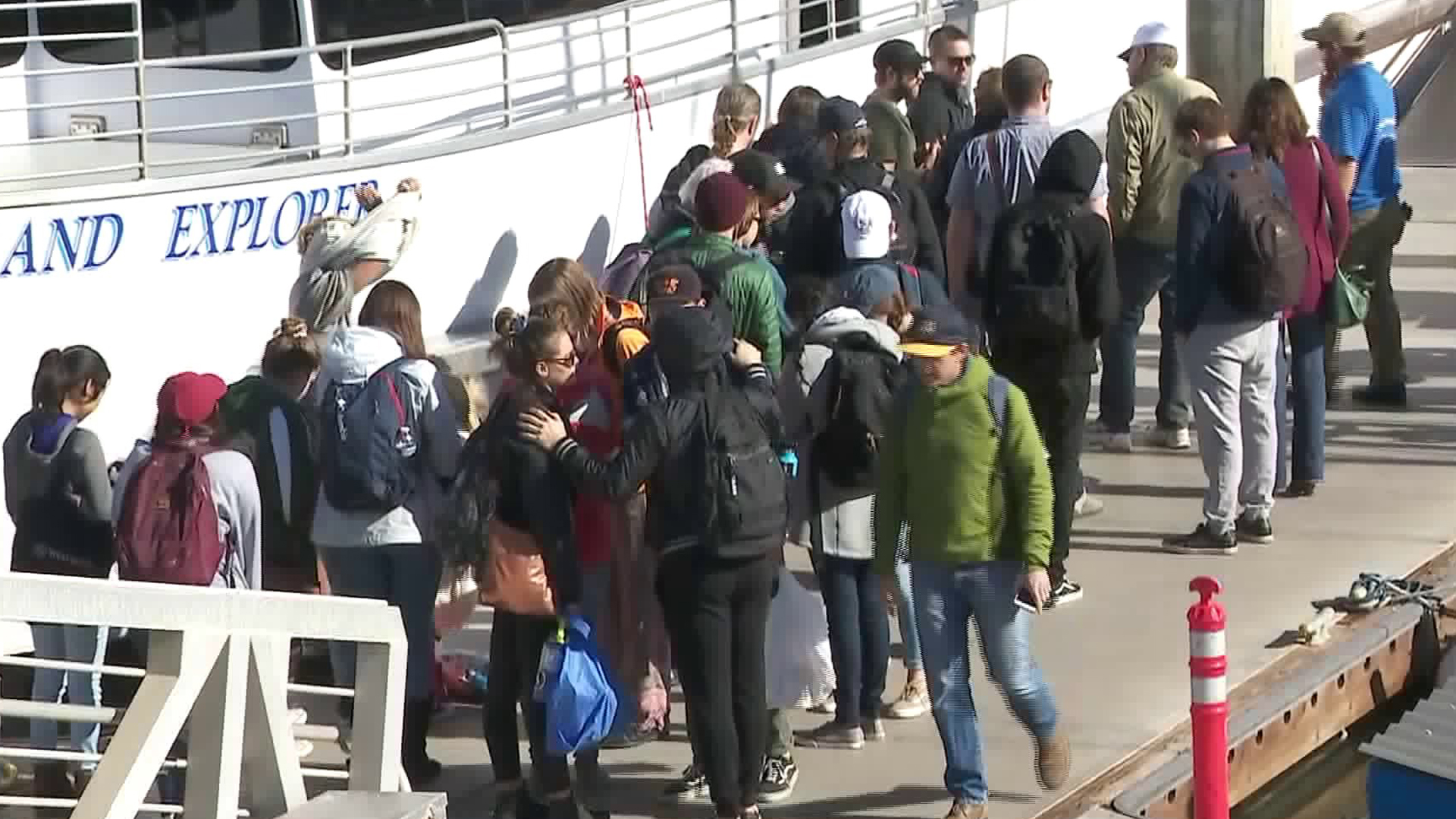 People line up on the deck alongside a ferry from Island Packers in Ventura to travel by boat to Santa Barbara, as freeways remain closed due to mudslides, on Jan. 10, 2018. (Credit: KTLA)