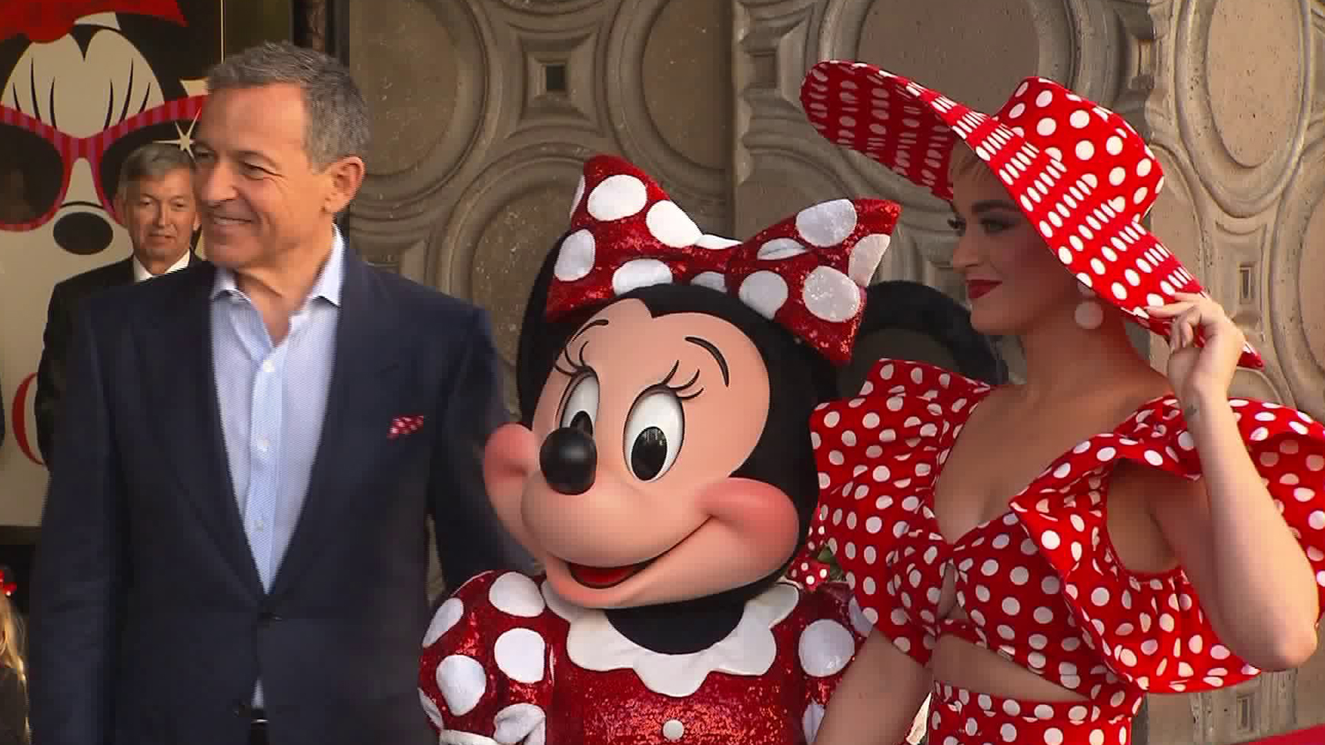 Minnie Mouse appears alongside Walt Disney CEO and Chairman Robert A. Iger and pop singer Katy Perry during her Hollywood Walk of Fame ceremony outside the El Capitan Theatre in Hollywood on Jan. 22, 2018. (Credit: CNN)