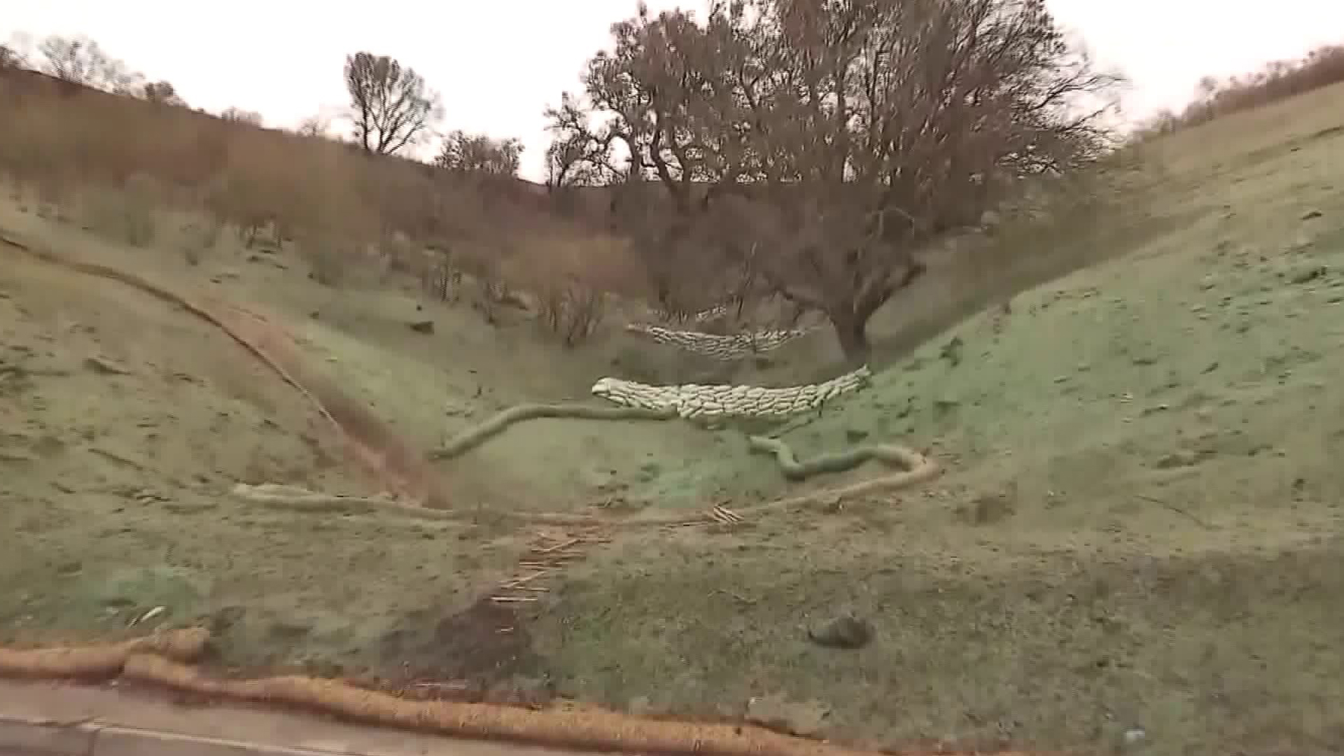 A burned hillside in Anaheim Hills, where the Canyon Fire 2 broke out in October 2016, is seen on Jan. 8, 2018, just before an expected downpour of rain. (Credit: KTLA)