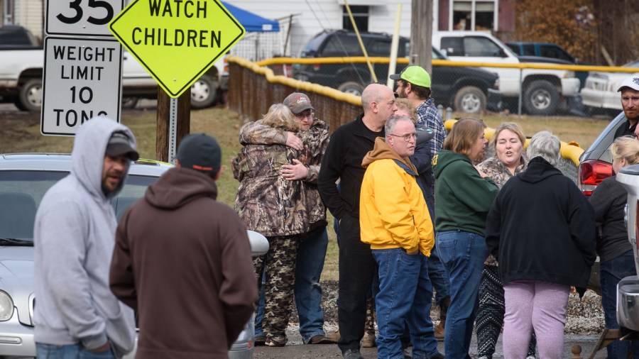 Family members and friends console each other after four people are killed at a Pennsylvania car wash. (Credit: Getty Images North America/Getty Images