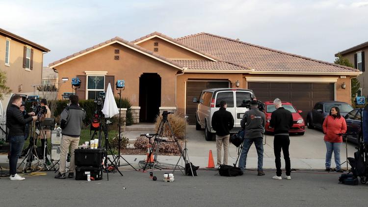 Members of the media camp out in front of the Perris home of David Allen and Louise Anna Turpin on Jan. 16, 2018. The couple were arrested on suspicion of torture and child endangerment after their 13 children were found shackled and malnourished. (Credit: Irfan Khan / Los Angeles Times)