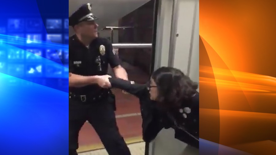 Bethany Renee Nava is seen being pulled off a Metro train on Jan. 22, 2018. (Credit: Brock Bryan)