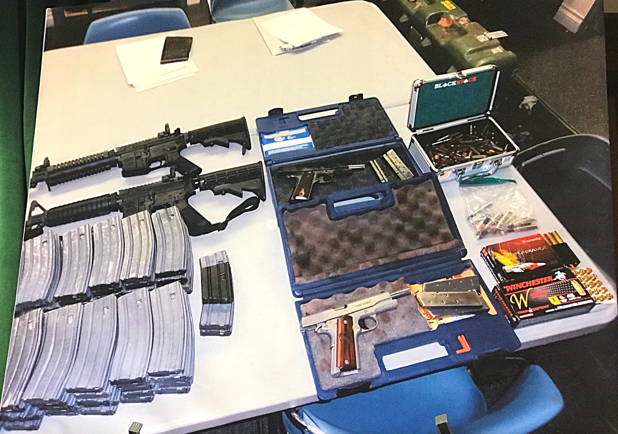 A weapons cache confiscated from the home of a 17-year-old who allegedly threatened to shoot up his Whittier-area high school is shown at a sheriff's news conference on Feb. 21, 2018. (Credit: Steve Kuzj / KTLA)