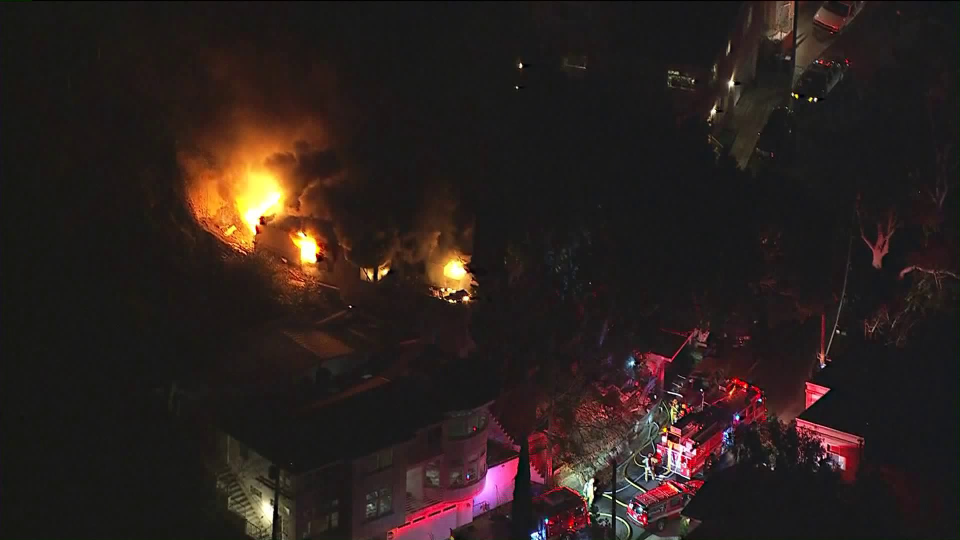 Firefighters battle a blaze at a home in Mount Washington on Feb. 23, 2018. (Credit: KTLA)