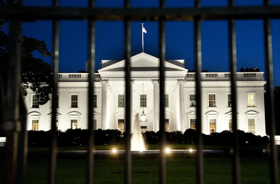 The White House is seen at dusk on the eve of a possible government shutdown as Congress battles out the budget in Washington, D.C, on Sept. 30, 2013. (Credit: Saul Loeb/AFP/Getty Images)