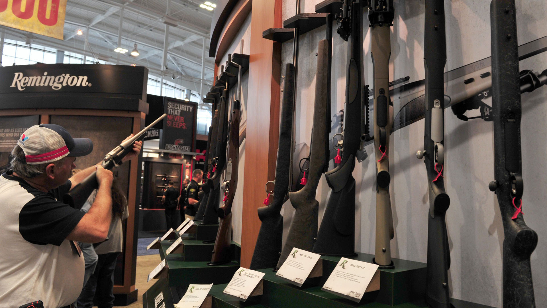 A convention attendee looks at a Remington bolt action rifle at the 2015 NRA Annual Convention in Nashville, Tennessee on April 10, 2015. (Credit: KAREN BLEIER/AFP/Getty Images)