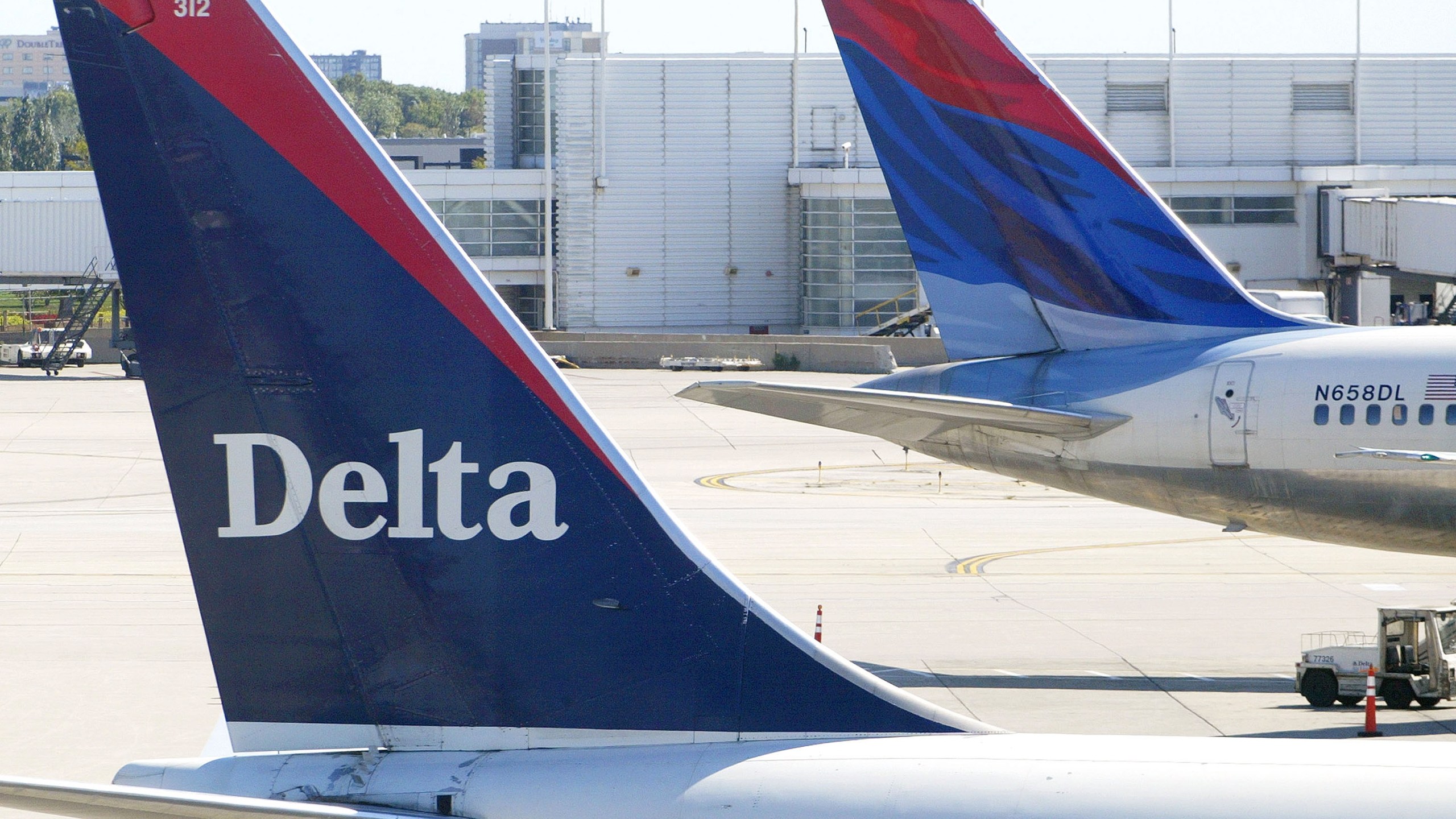 Tails of two Delta Air Lines jets are seen on Sept. 17, 2004 at O'Hare International Airport in Chicago, Illinois. (Credit: Tim Boyle/Getty Images)