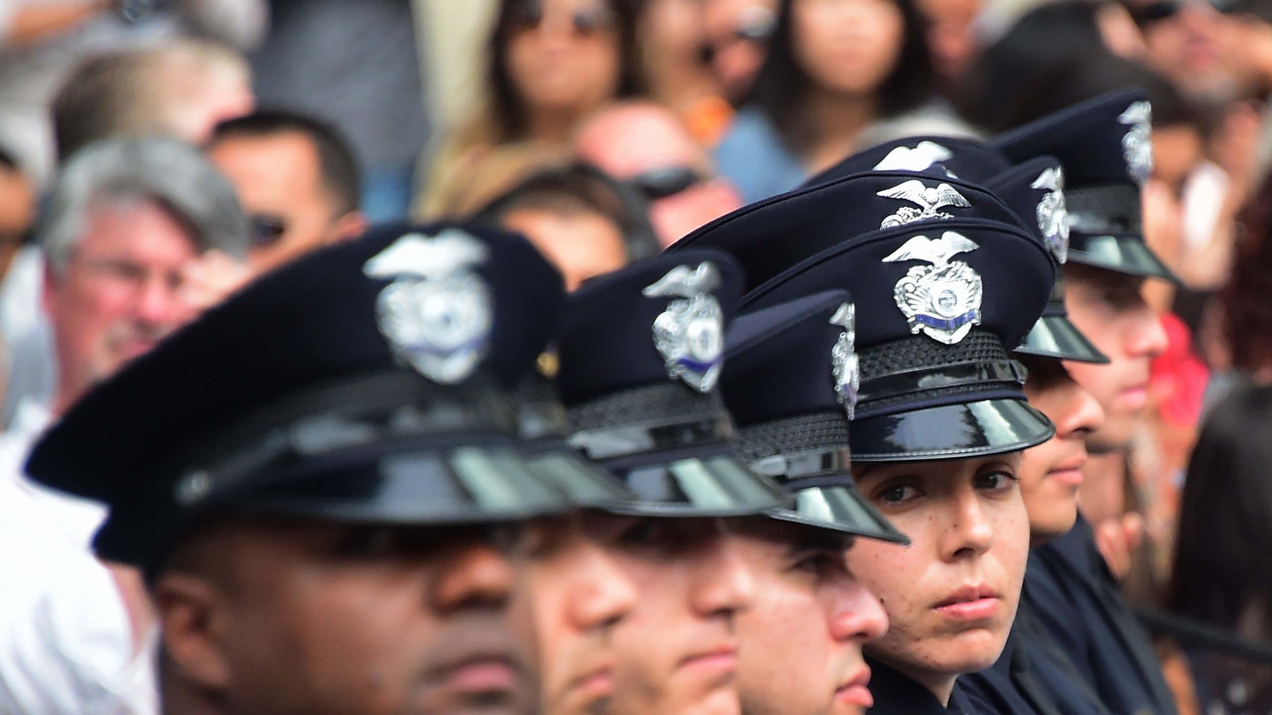 Recruits attend their graduation ceremony at Los Angeles Police Department Headquarters on July 8, 2016. (Credit: Frederic J. Brown / AFP / Getty Images)