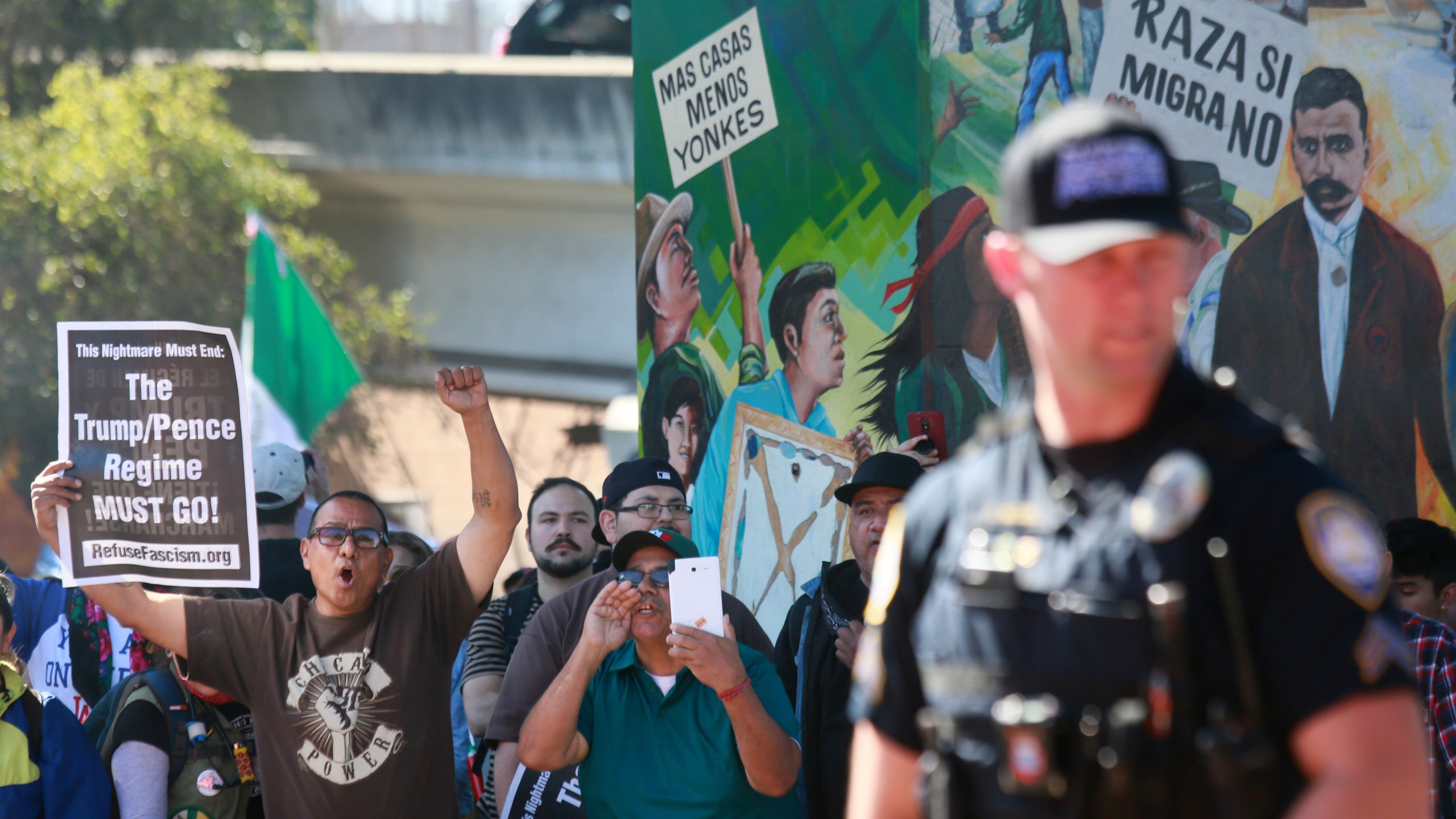 Counter-demonstators chant during a "Patriot Picnic" demonstration at Chicano Park in San Diego on Feb. 3, 2018. (Credit: Sandy Huffaker / AFP / Getty Images)