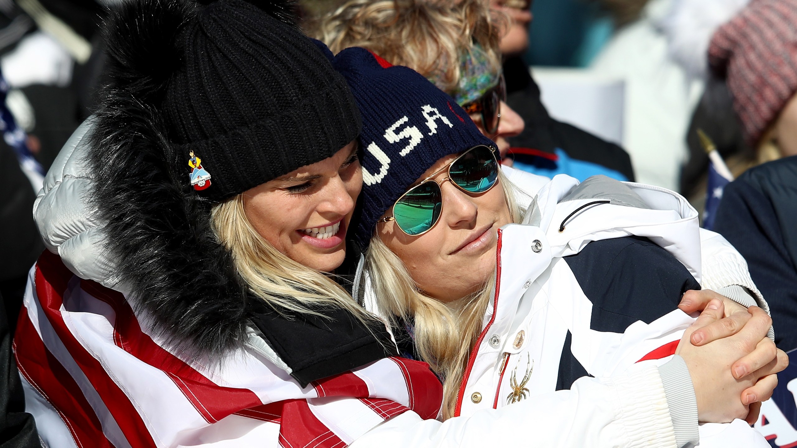 Lindsey Vonn of the United States, at right, is consoled at the finish during the Alpine Skiing Ladies Super-G at the PyeongChang 2018 Winter Olympics on Feb. 17, 2018. (Credit: Clive Mason / Getty Images)