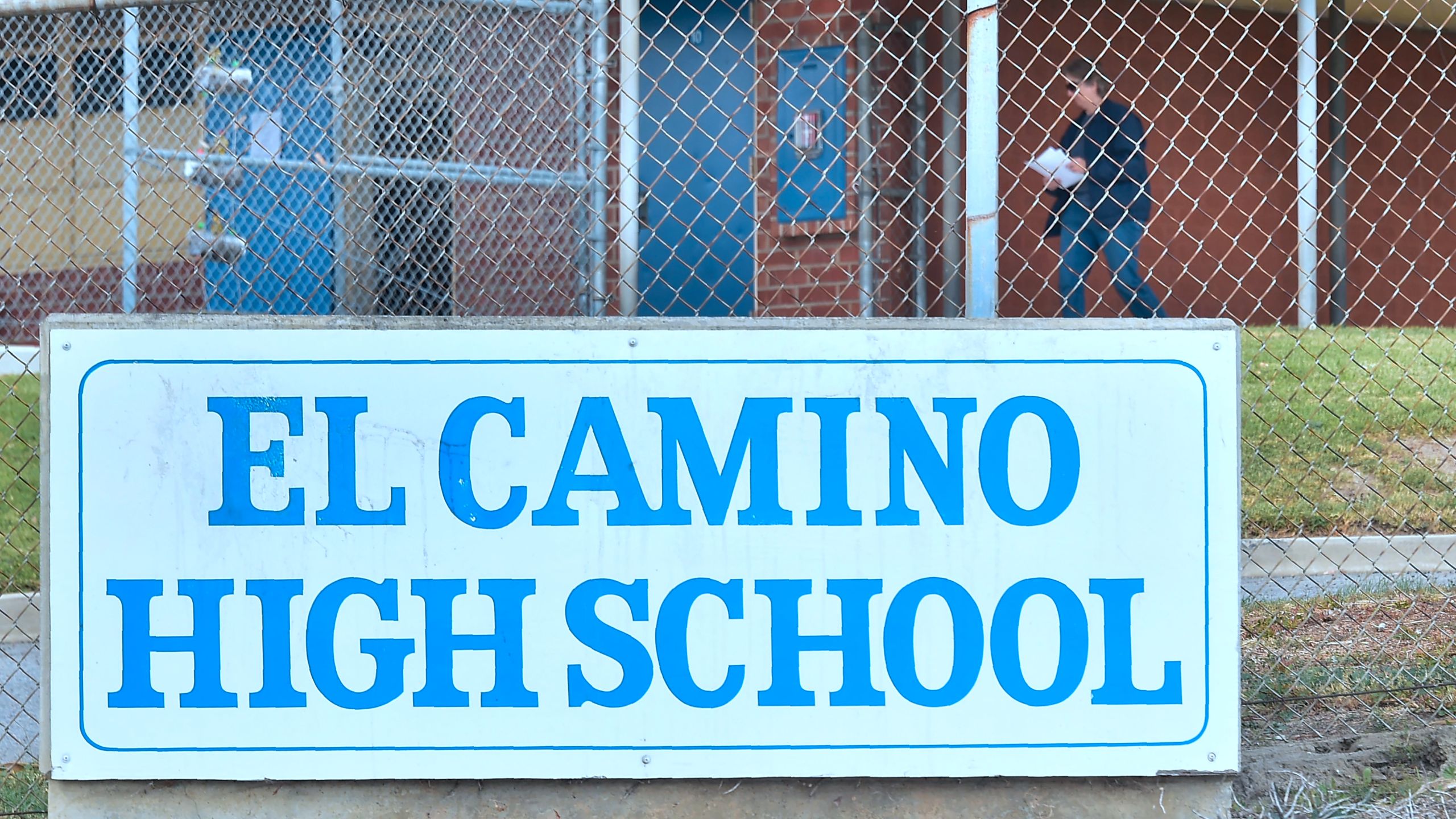 A man is seen walking on the campus of El Camino High School in South Whittier on Feb. 21, 2018, after a threat by a student was overheard by a school safety officer. (Credit: Frederic J. Brown / AFP / Getty Images)