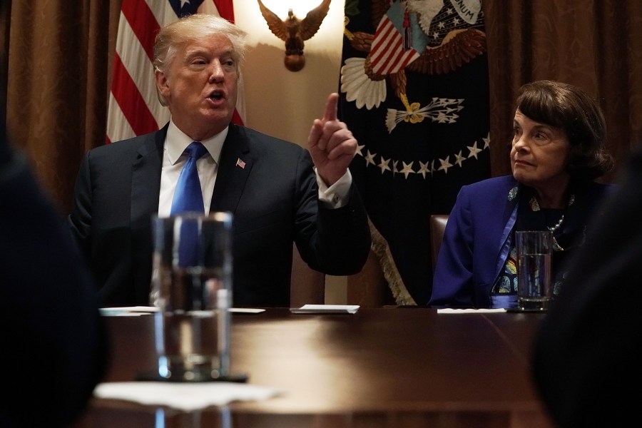 Donald Trump speaks as Sen. Dianne Feinstein (D-CA) listens during a meeting with bipartisan members of the Congress at the Cabinet Room of the White House on Feb. 28, 2018. (Credit: Alex Wong/Getty Images)