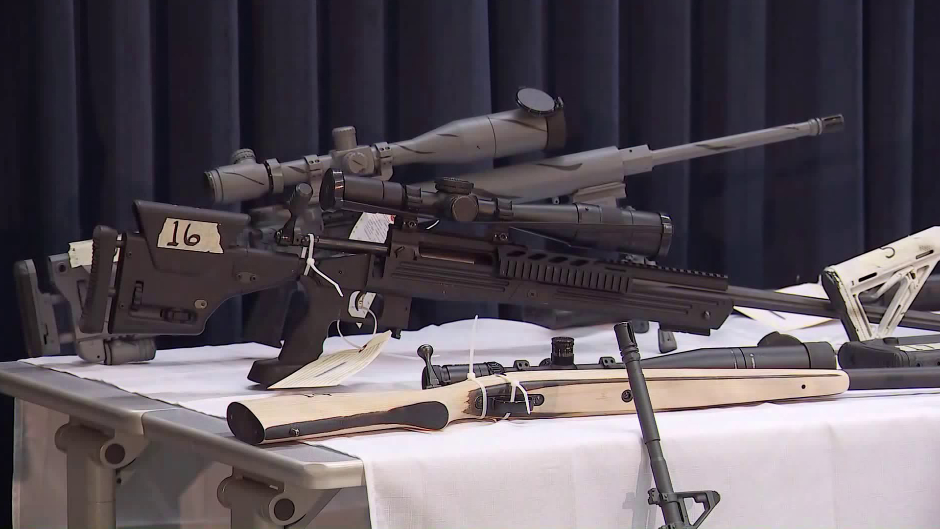 A weapons cache seized at Steven Ponder's Temple City home is shown at a downtown L.A. news conference on Feb. 21, 2018. (Credit: KTLA)