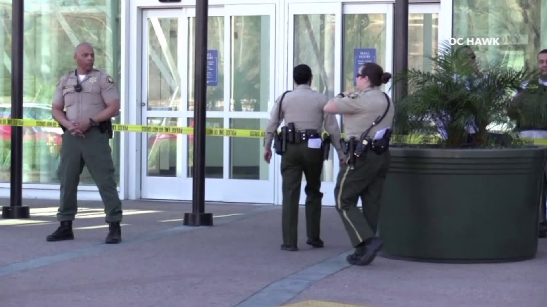 Officers stand outside the Moreno Valley Mall after report of a gunfire triggered a lockdown on Feb. 8, 2018. (Credit: OC Hawk)