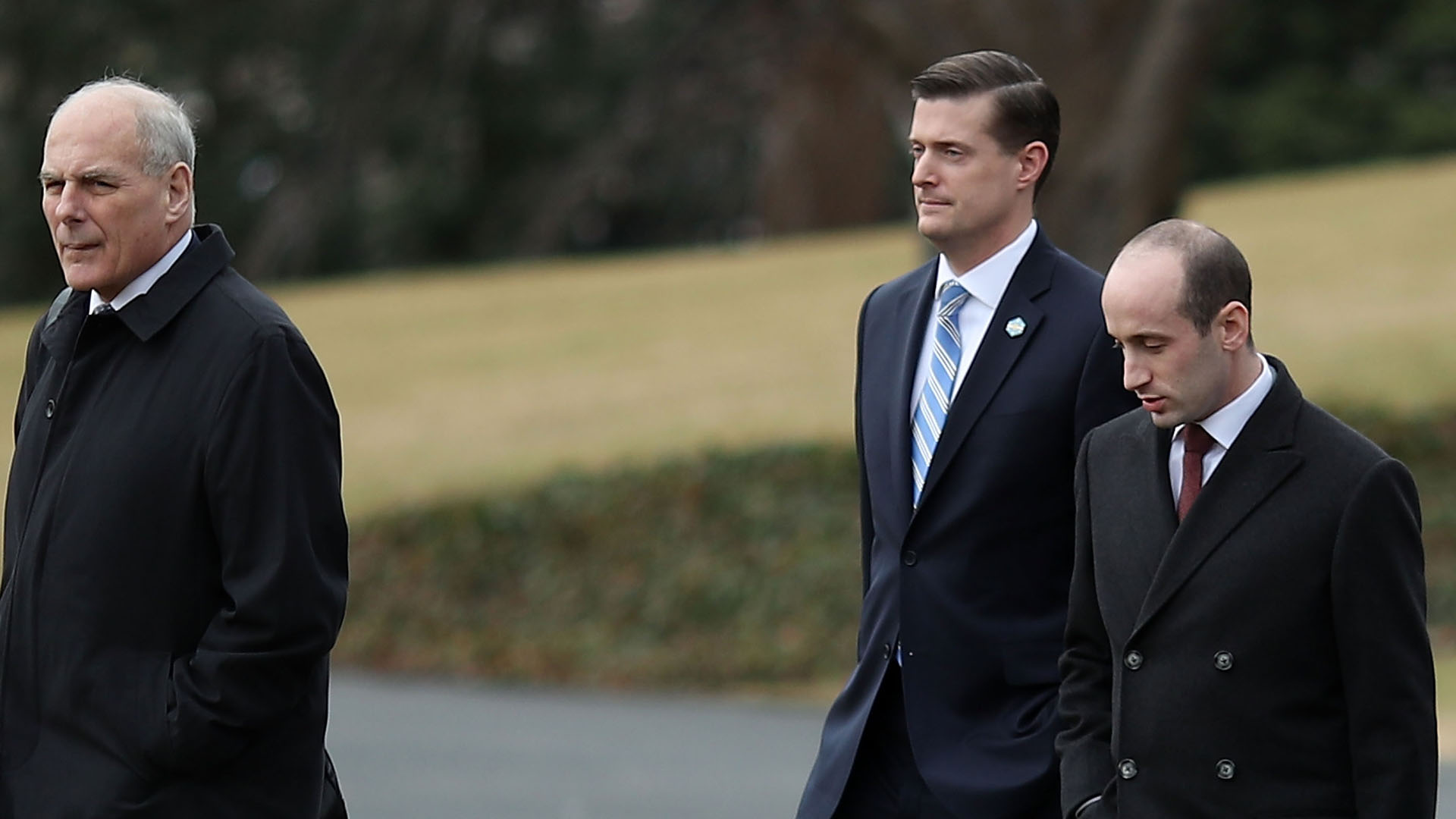 White House chief of staff John Kelly, left, walks with staff secretary Rob Porter, center, and White House senior advisor Stephen Miller, before boarding Marine One to depart from the White House with President Donald Trump, on Feb. 1, 2018, in Washington, D.C. (Credit: Mark Wilson/Getty Images)