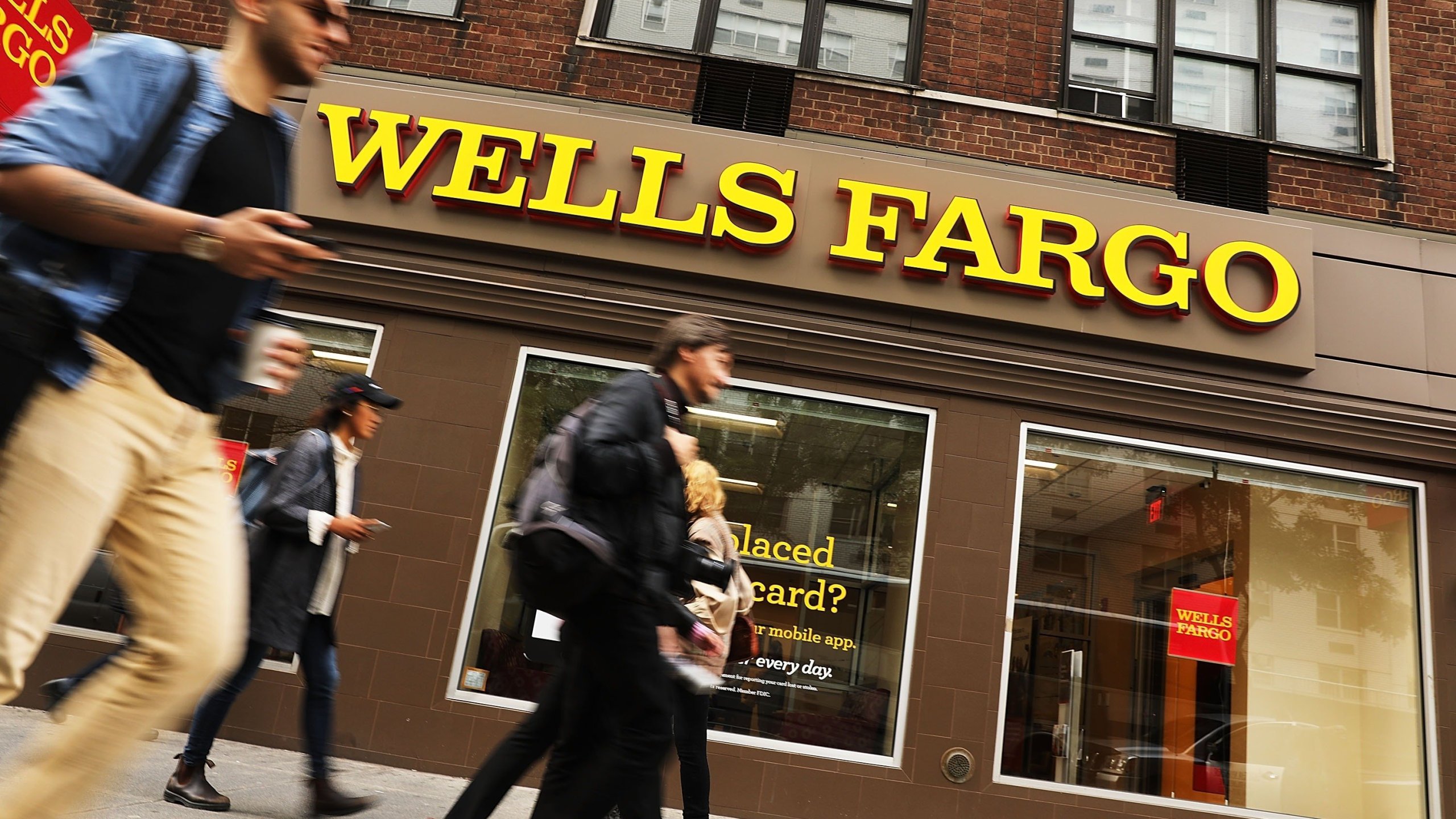 The Fed handed down unprecedented punishment for what it called Wells Fargo's "widespread consumer abuses," including its notorious creation of millions of fake customer accounts. (Credit: Getty via CNN)