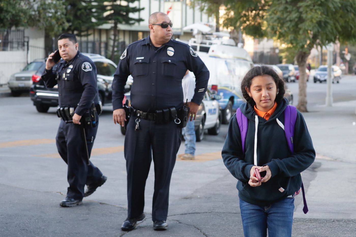 LAPD officers were on hand as students returned to Salvador Castro Middle School on on Feb. 2, 2018, following a school shooting that left four students injured. (Credit: Irfan Khan / Los Angeles Times)