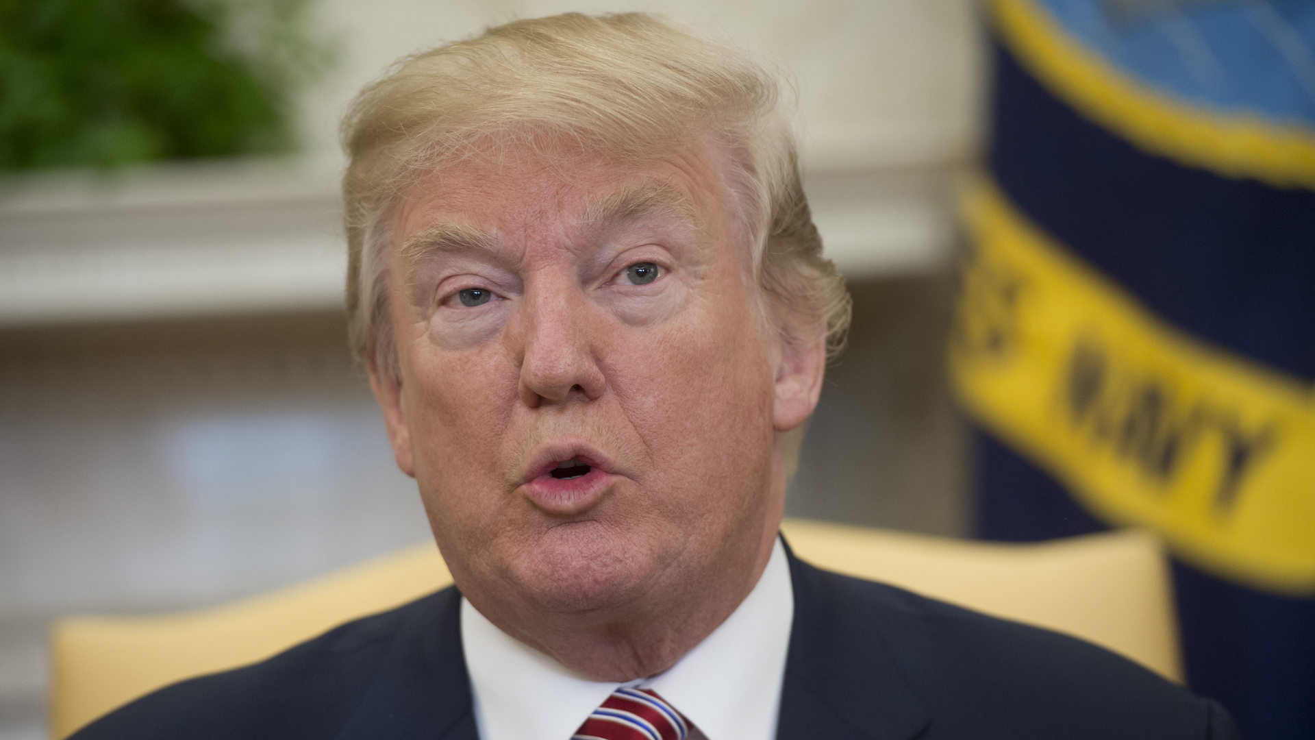 President Donald Trump speaks to the press in the Oval Office of the White House in Washington, DC, February 9, 2018. (Credit: SAUL LOEB/AFP/Getty Images)