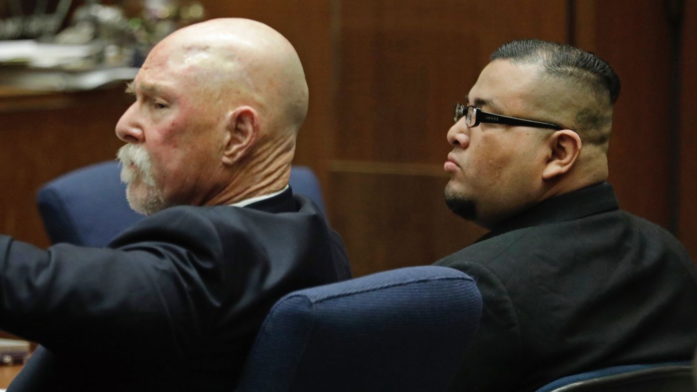 Jorge Palacios, right, sits with lawyer Lawrence Forbes during closing arguments in his trial on March 1, 2018. (Credit: Myung J. Chun / Los Angeles Times)