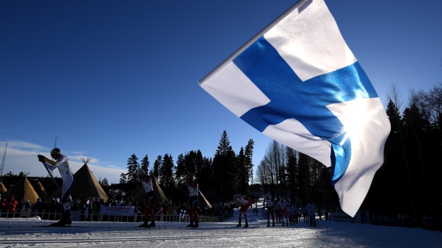 A Finland flag is waved as the skiers compete in the Men's Cross Country Skiathlon during the FIS Nordic World Ski Championships on February 25, 2017 in Lahti, Finland. (Credit: Matthias Hangst/Getty Images)