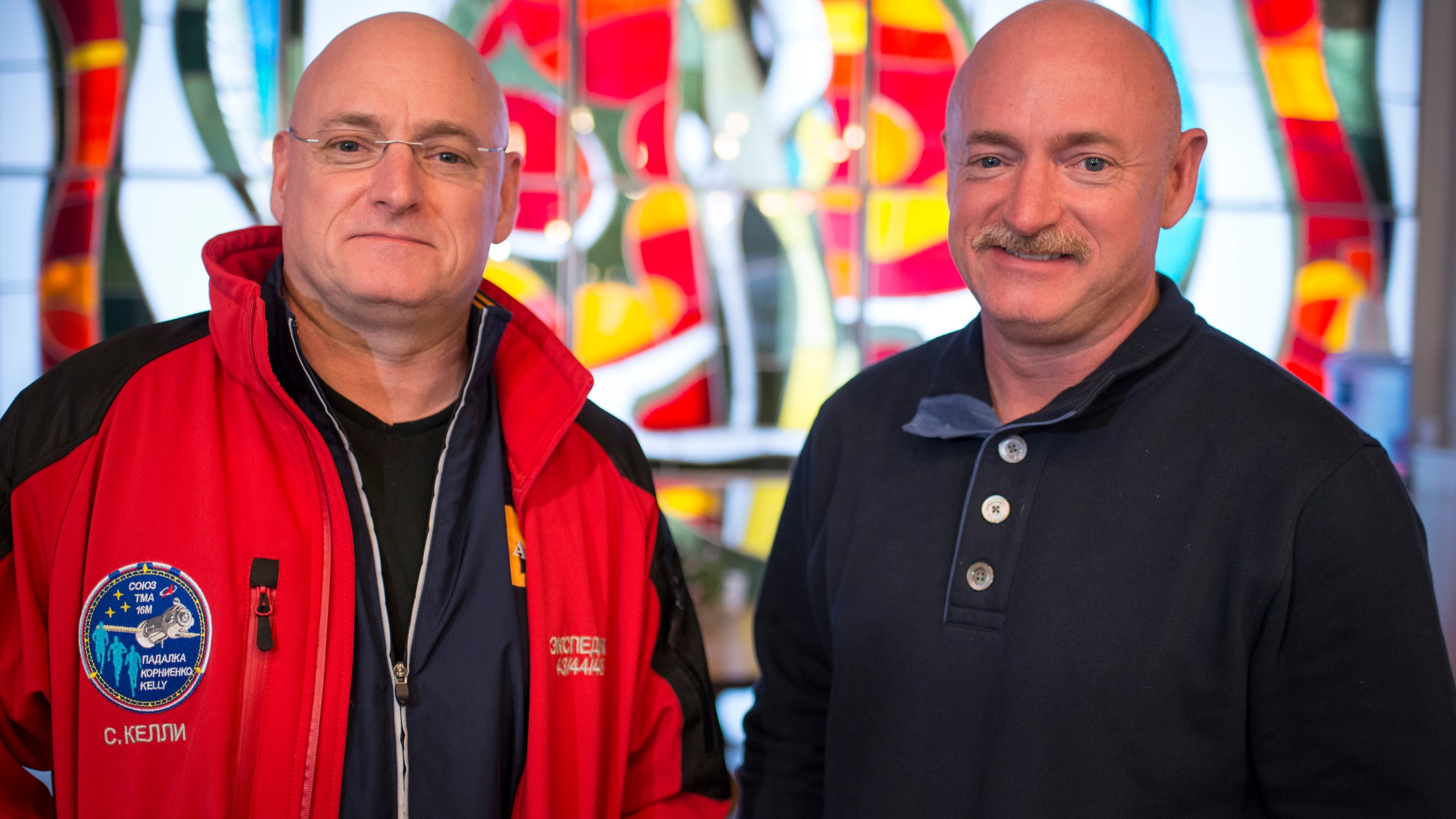 Expedition 43 NASA Astronaut Scott Kelly, left, and his identical twin brother Mark Kelly, pose for a photograph March 26, 2015, at the Cosmonaut Hotel in Baikonur, Kazakhstan. (Credit: Bill Ingalls/NASA via Getty Images)