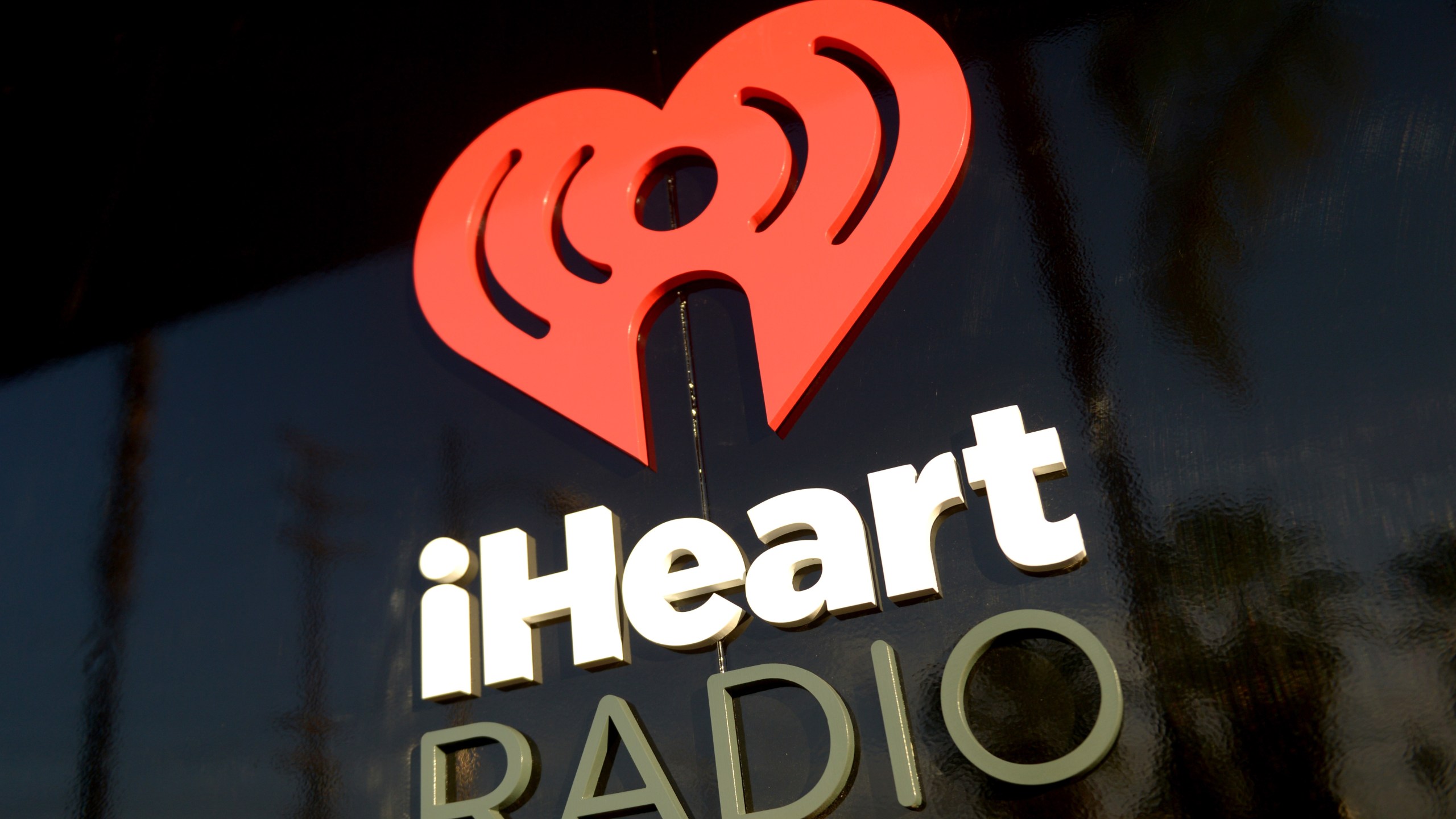 iHeartRadio logo is seen during the Coldplay iHeartRadio Album Release Party at the iHeartRadio Theater Los Angeles on May 16, 2014. (Credit: Jason Kempin/Getty Images for Clear Channel)