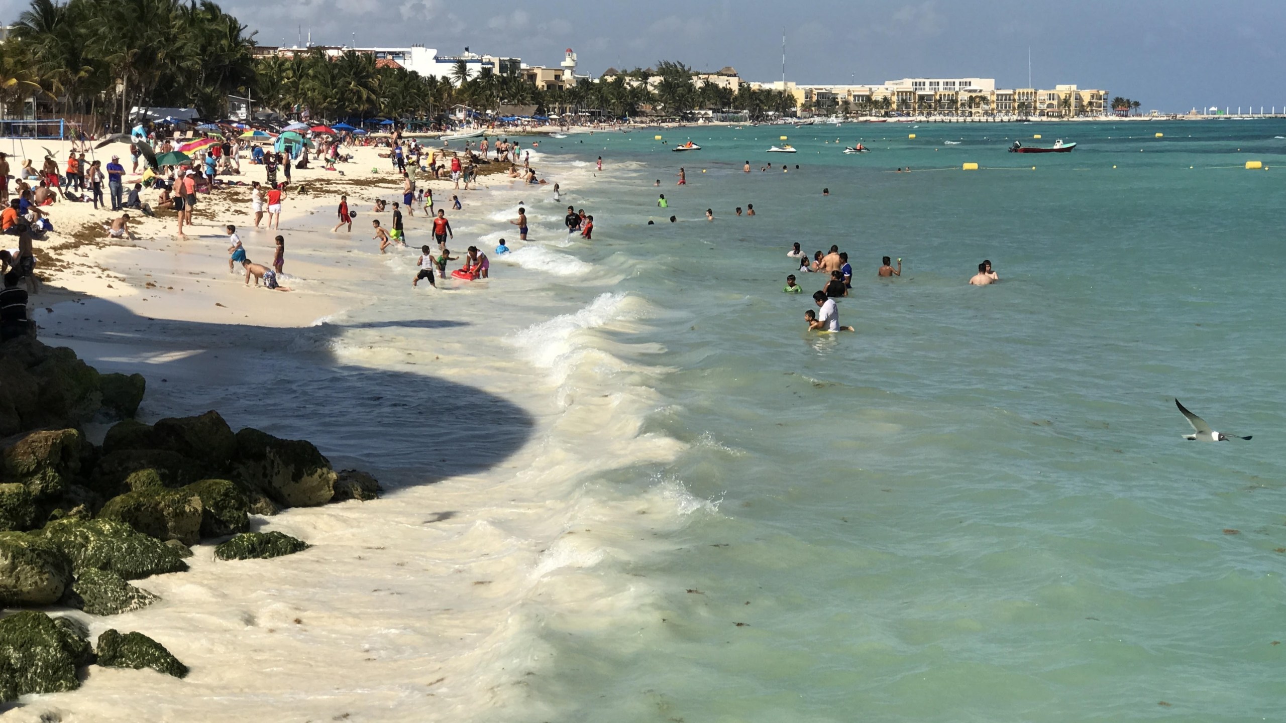 Tourists enjoy the beach at the Playa del Carmen in Quintana Roo state, Mexico, on March 28, 2017. (Credit: Daniel Slim / AFP / Getty Images)