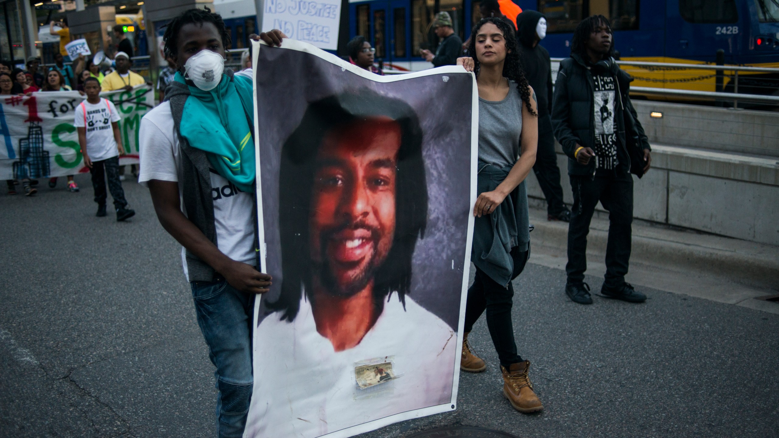 Protestors carry a portrait of Philando Castile on June 16, 2017 in St Paul, Minnesota. (Credit: Stephen Maturen/Getty Images)