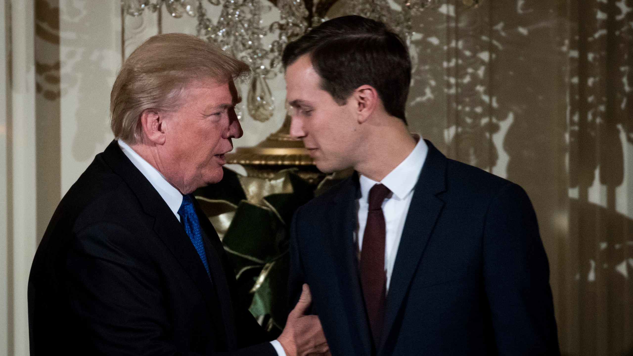 President Donald Trump talks with White House Senior Adviser Jared Kushner as they attend a Hanukkah reception in the East Room of the White House, Dec. 7, 2017. (Credit: Drew Angerer / Getty Images)