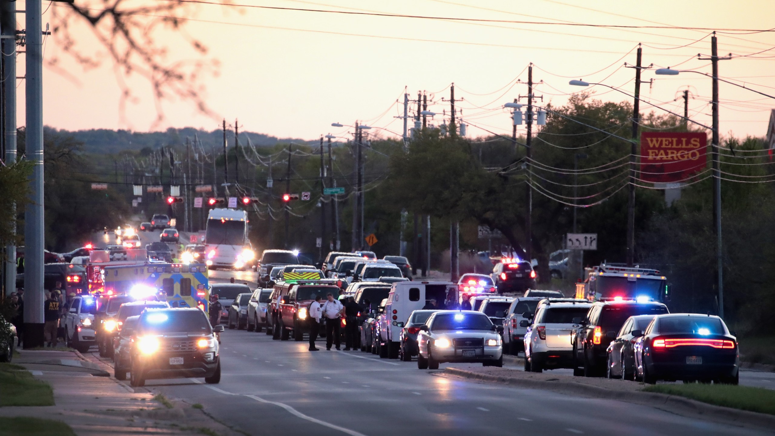 Police respond after one person was injured by a package containing an incendiary device at a nearby Goodwill store on March 20, 2018 in Austin, Texas. (Credit: Scott Olson/Getty Images)