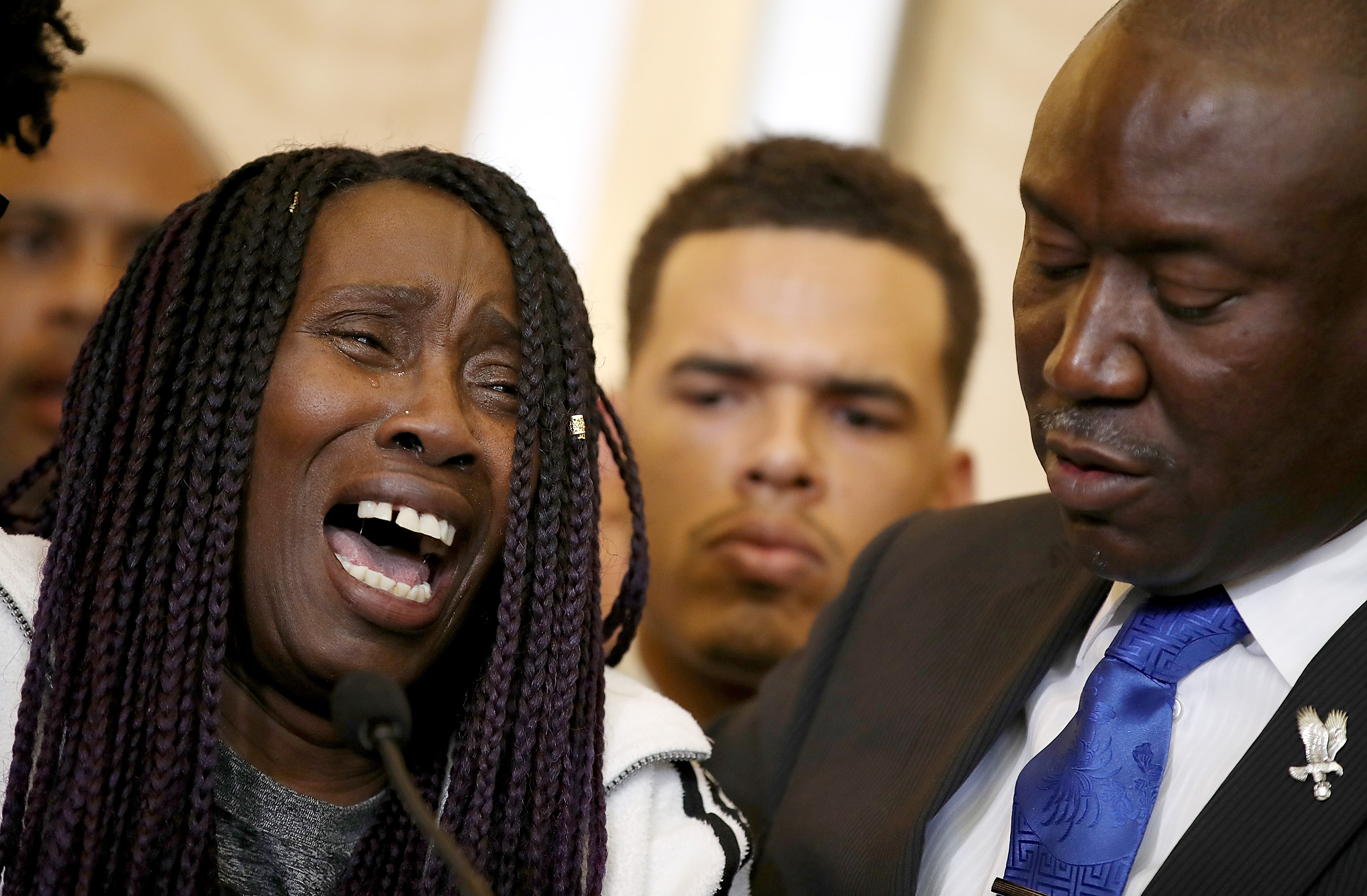 Sequita Thompson, left, grandmother of Stephon Clark, who was shot and killed by Sacramento police, cries as she speaks during a news conference with civil rights attorney Ben Crump on March 26, 2018, in Sacramento. (Credit: Justin Sullivan / Getty Images)