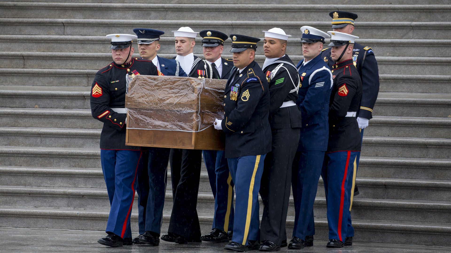 A military honor guard carries the casket of Rev. Billy Graham out of the U.S. Capitol on March 1, 2018. (Credit: Tasos Katopodis-Pool/Getty Images)