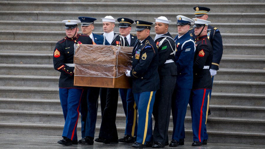 A military honor guard carries the casket of Rev. Billy Graham out of the U.S. Capitol on March 1, 2018. (Credit: Tasos Katopodis-Pool/Getty Images)