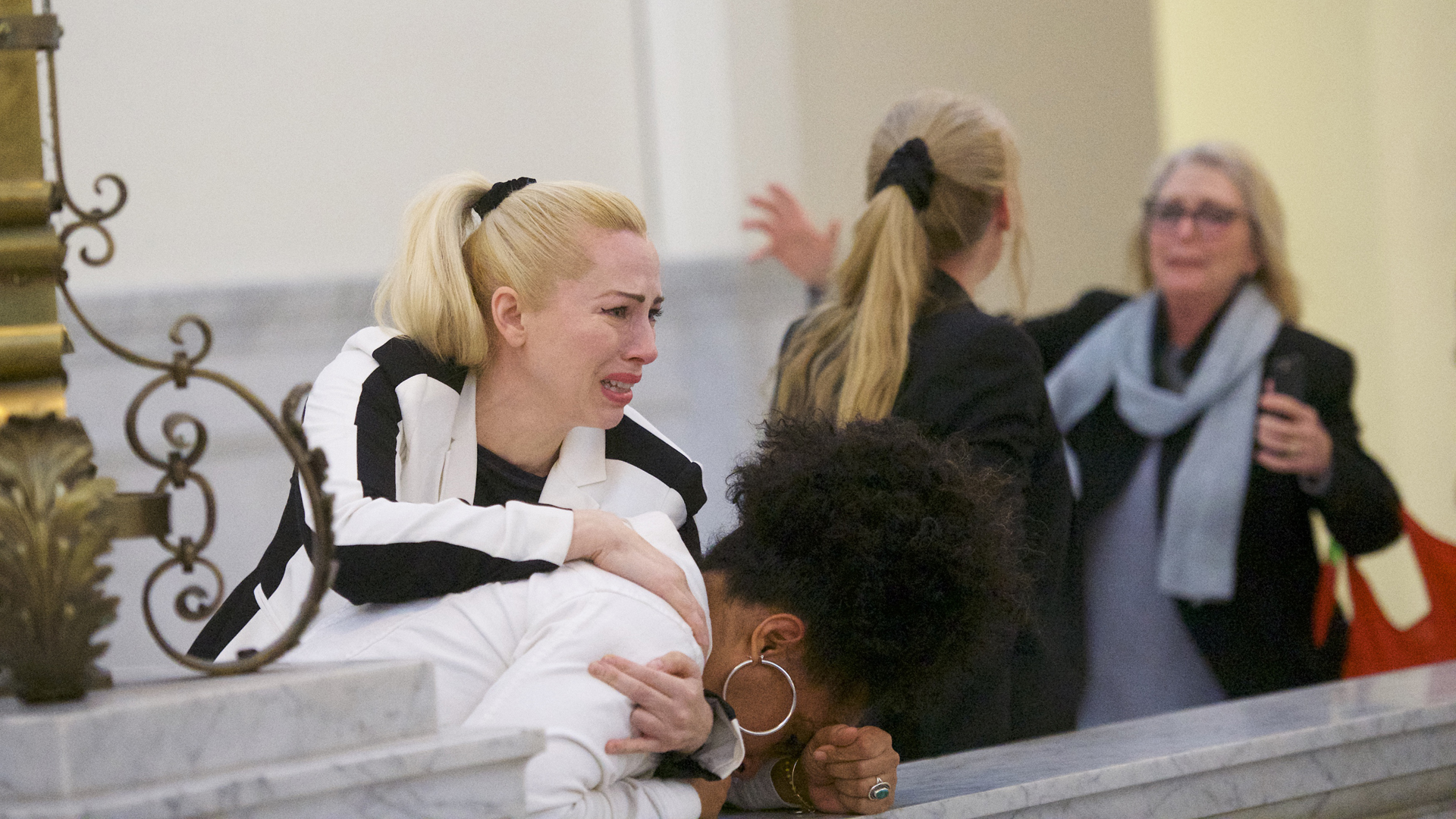 Bill Cosby accusers (L-R) Caroline Heldman, Lili Bernard and Victoria Valentino (far right) react after the guilty on all counts verdict was delivered in the sexual assault retrial at the Montgomery County Courthouse on April 26, 2018 in Norristown, Pennsylvania.. (Credit: Mark Makela/Getty Images)