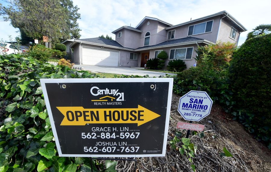 An open house sign directs prospective buyers to property for sale in Monterey Park on April 19, 2016. (Credit: Frederic J. Brown / AFP / Getty Images)