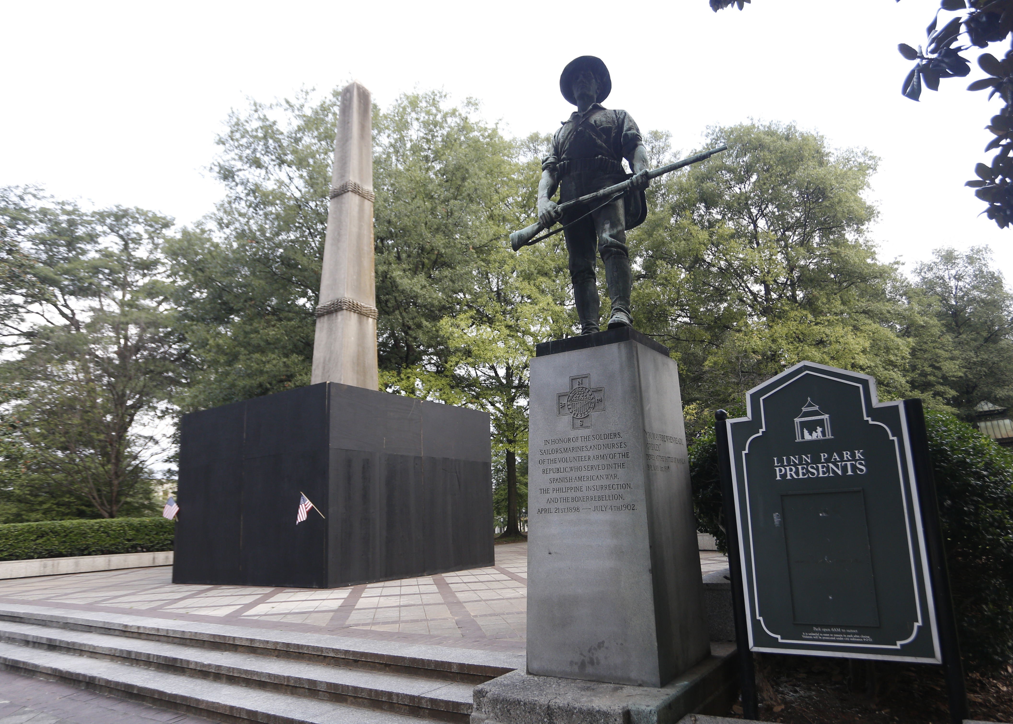 A monument to volunteers of the Army of the Republic stands next to a confederate monument covered up by the mayor of Birmingham in Linn Park August 18, 2017 in Birmingham, Alabama. (Credit: Hal Yeager/Getty Images)