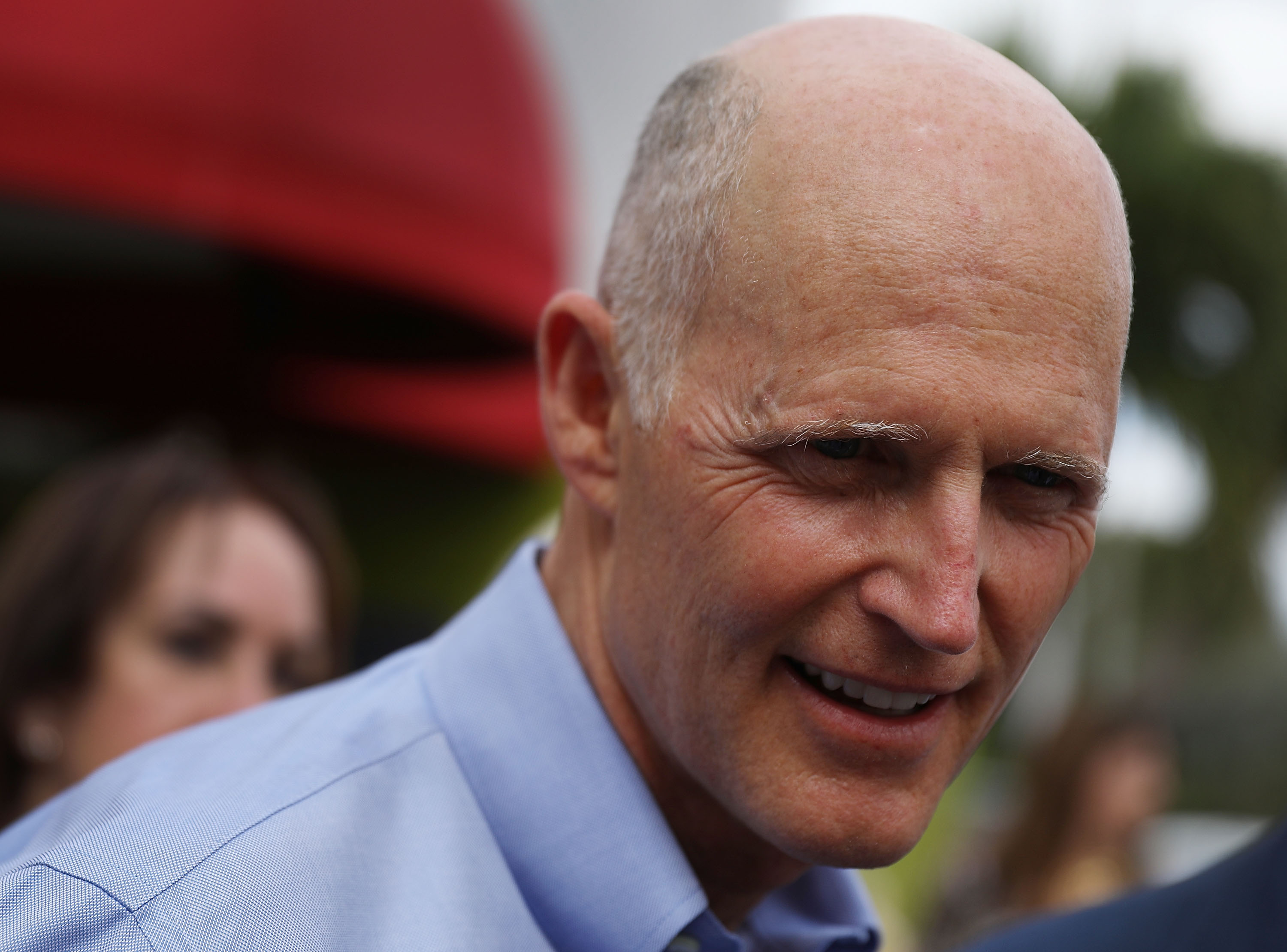 Florida Governor Rick Scott interacts with people on March 28, 2018 in Doral, Florida. (Credit: Joe Raedle/Getty Images)